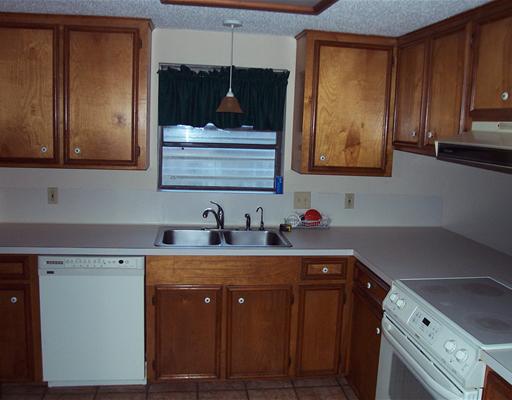 4925 Valley Stream Drive Corpus Christi, TX 78413 - Photo 6 of 10 a kitchen with a sink and cabinets