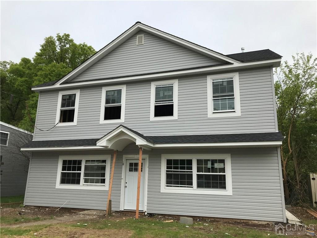 39 Caldwell Road Edison, NJ 08817 - Photo 1 of 1 a front view of a house with a garage