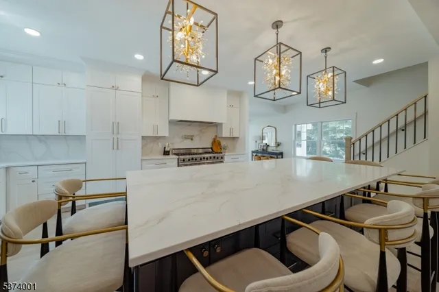 a kitchen with a sink cabinets and appliances