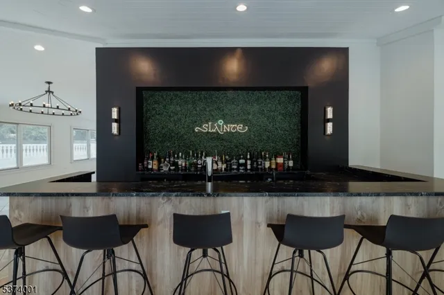 a kitchen with a table and chairs in it