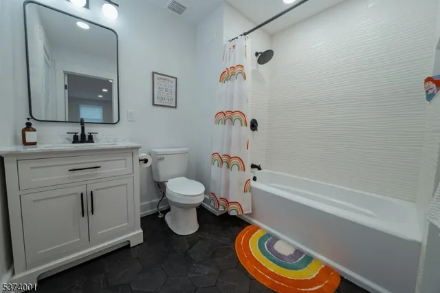 a bathroom with a sink a toilet and a bathtub