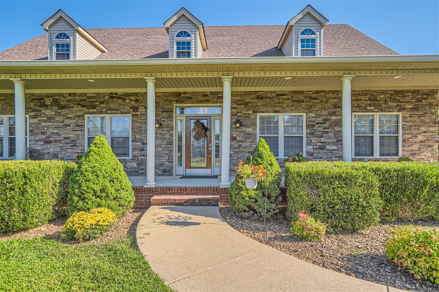 2378 Tom Fitzgerald Road Columbia, TN 38401 - Photo 3 of 34 a front view of a house with garden