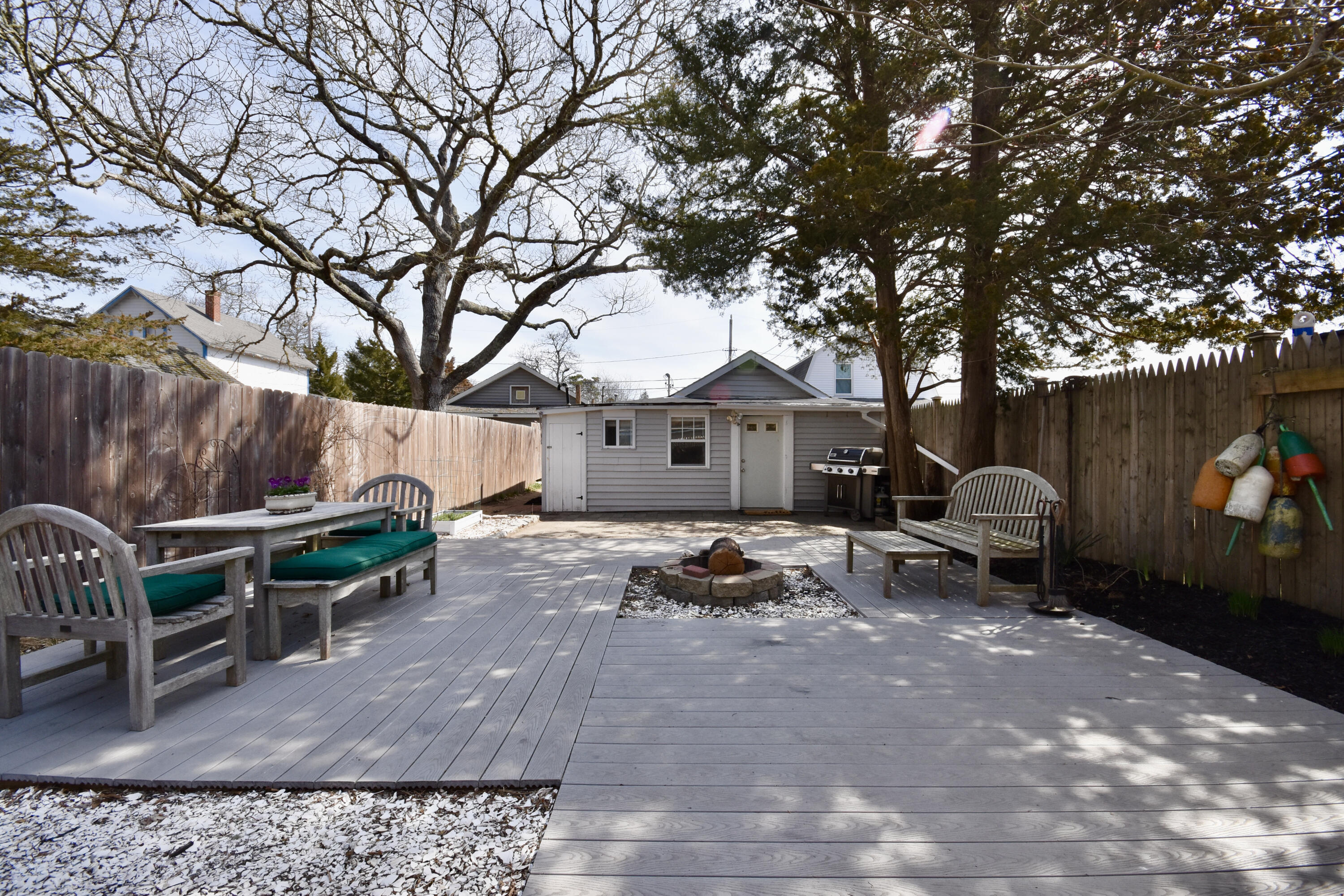 23 Barnes Street Wareham, MA 02571 - Photo 16 of 18 a view of a backyard with furniture and a patio