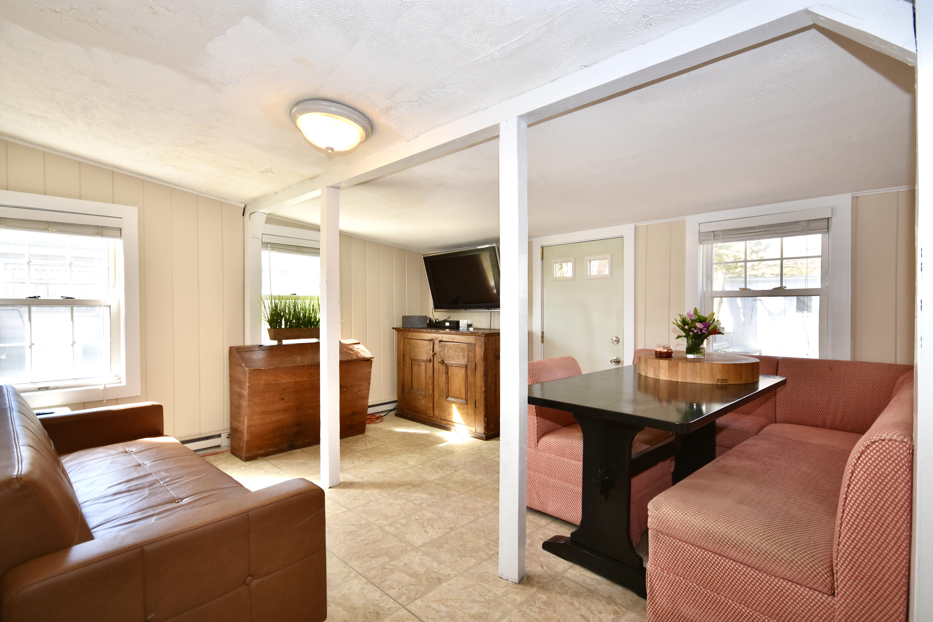 23 Barnes Street Wareham, MA 02571 - Photo 5 of 18 a view of a livingroom with furniture and a window