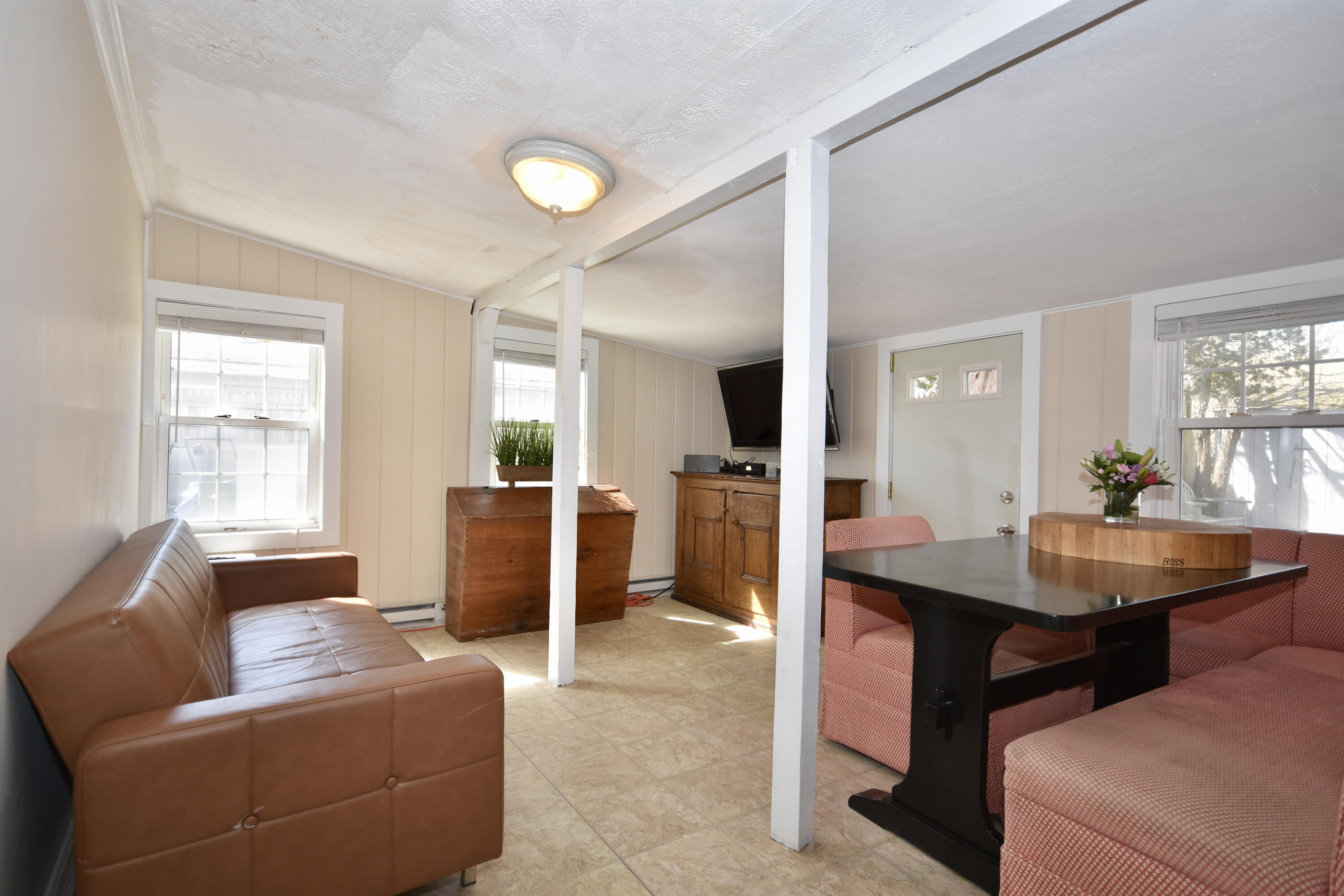 23 Barnes Street Wareham, MA 02571 - Photo 6 of 18 a living room with furniture and a table