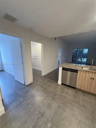 a view of a kitchen with a sink