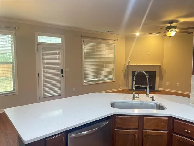 a kitchen with a sink and a window