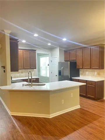 a view of kitchen with wooden floor