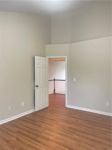 a view of wooden floor and brick walls