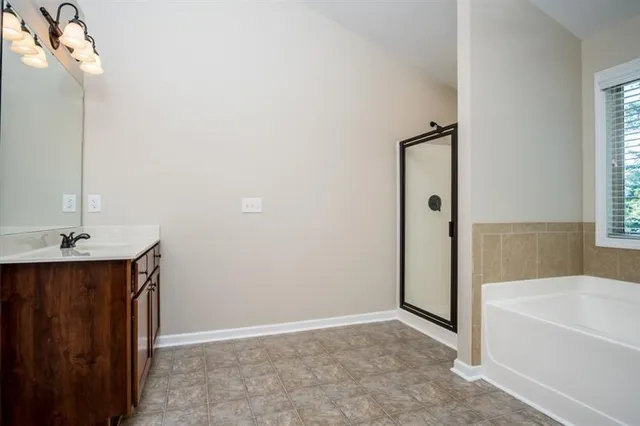 a bathroom with a bathtub and a sink
