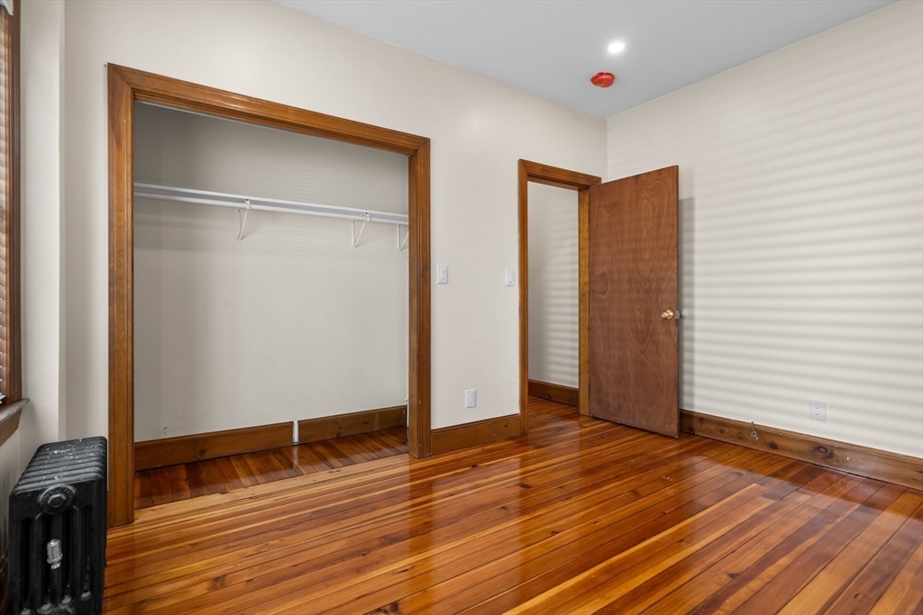 62 Vernal Street, Unit 3 Everett, MA 02149 - Photo 11 of 26 a view of an empty room with wooden floor