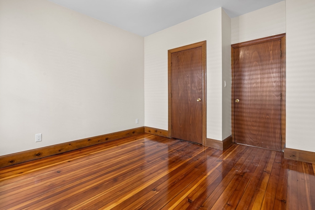 62 Vernal Street, Unit 3 Everett, MA 02149 - Photo 6 of 26 wooden floor in an empty room