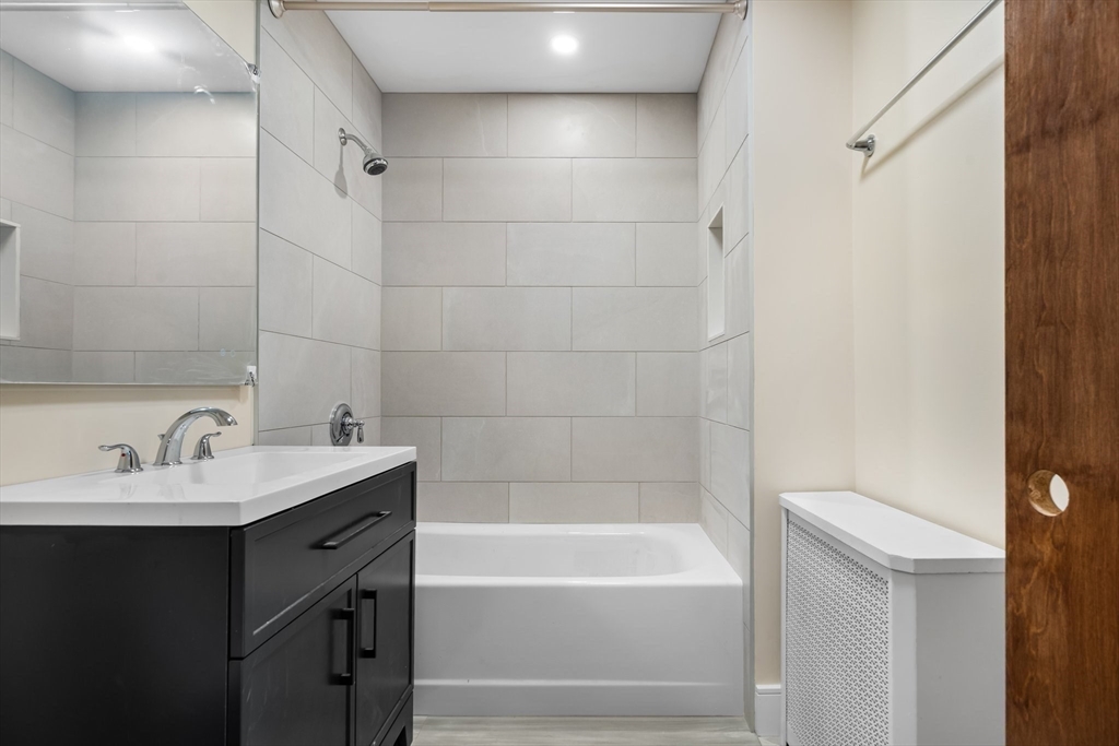 62 Vernal Street, Unit 3 Everett, MA 02149 - Photo 8 of 26 a bathroom with a bathtub and a sink
