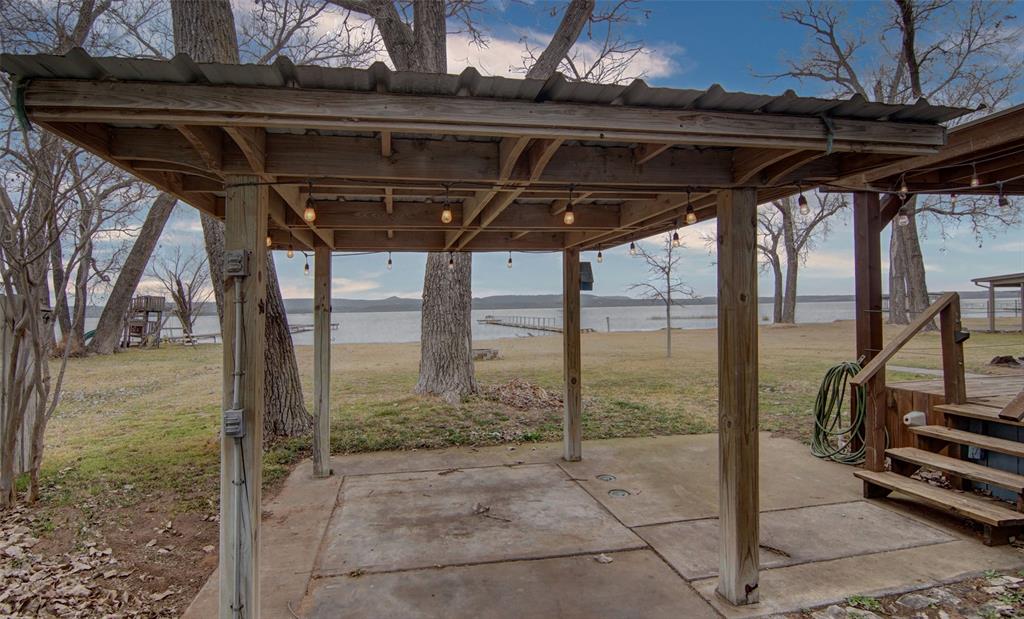 1059 Airport Road Graford, TX 76449 - Photo 25 of 35 View of patio featuring a water view