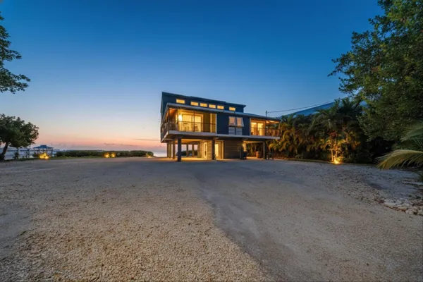 a kitchen with stainless steel appliances granite countertop a refrigerator and a stove