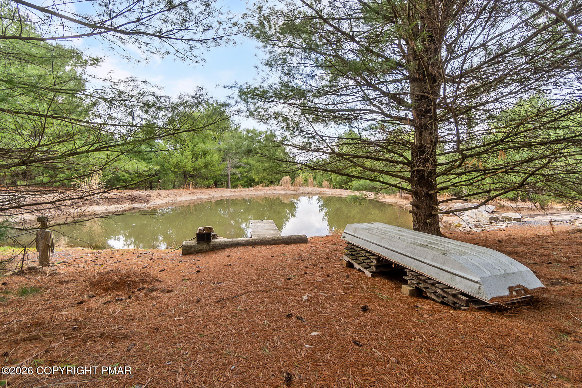 530 West Sunset Road Lehighton, PA 18235 - Photo 5 of 59 a view of a lake with a yard and large trees