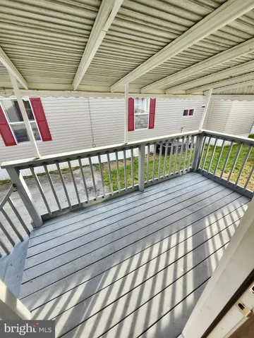 a view of a balcony with book shelf