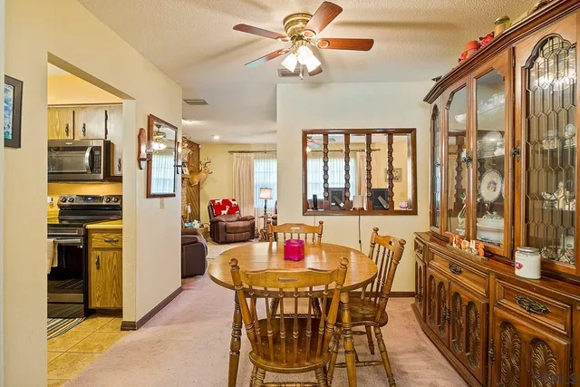a view of a dining room with furniture window and outside view