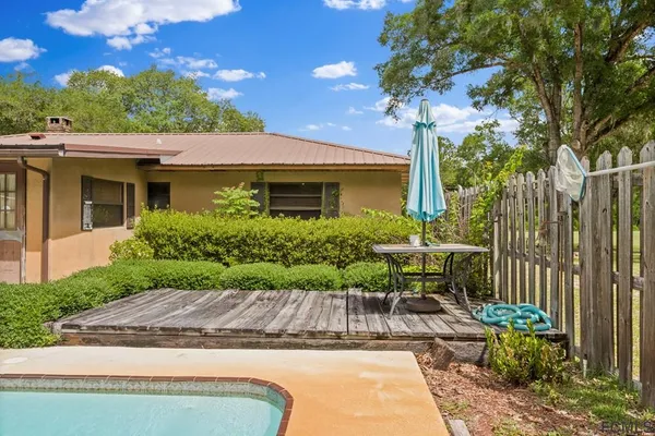 a view of a park with large trees