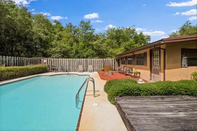 a view of a ocean with a building in the background