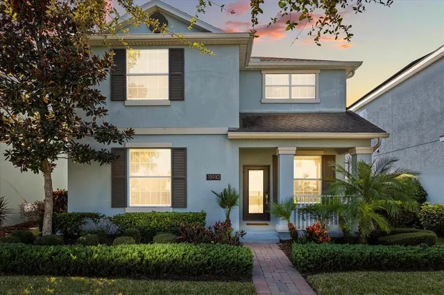 a front view of a house with garden