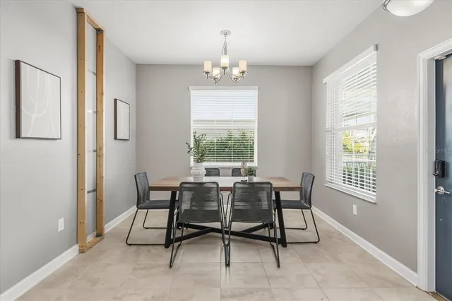 a dining room with furniture and window