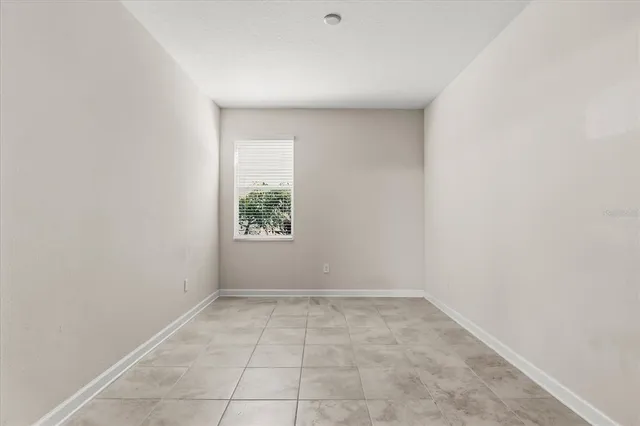 a view of kitchen with refrigerator and oven