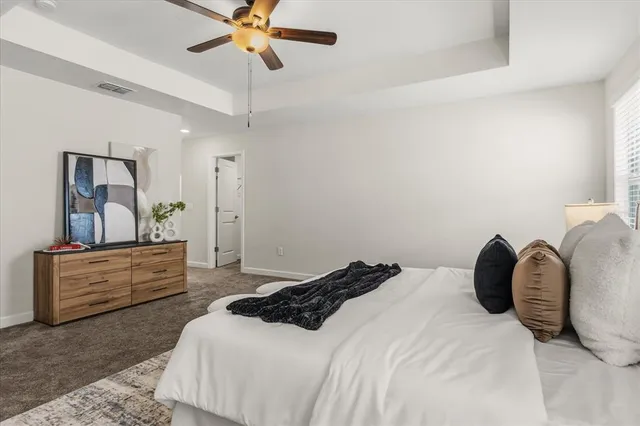 a spacious bathroom with a tub double sink shower and mirror