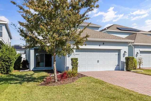 a front view of a house with yard