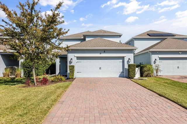 an aerial view of a house with swimming pool