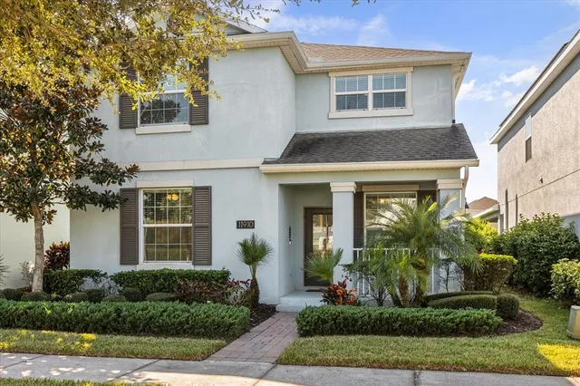 an aerial view of residential houses with outdoor space and street view