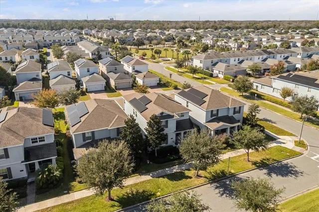 an aerial view of ocean and residential houses