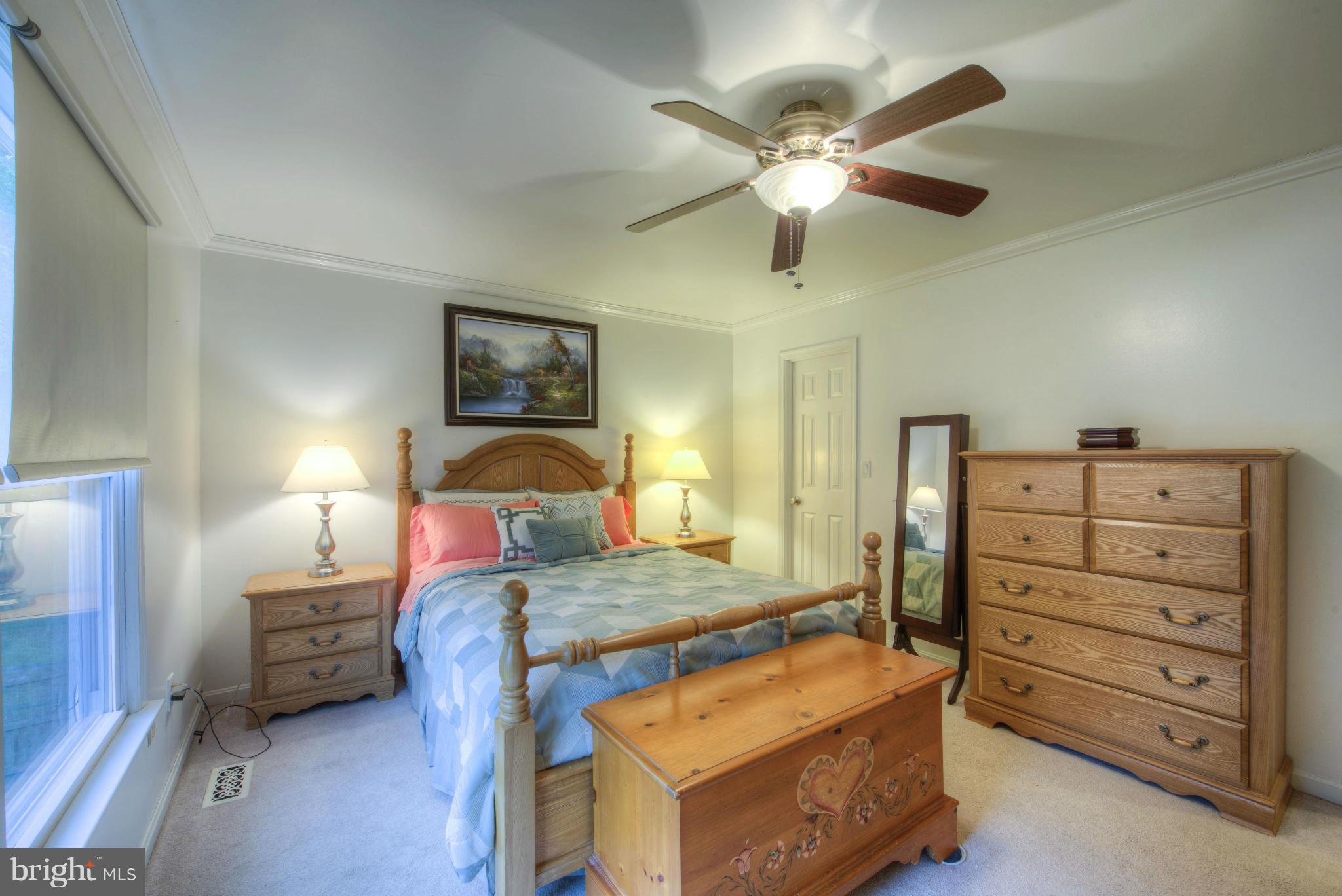 55 Buck Road Stafford, VA 22556 - Photo 11 of 19 a bedroom with a bed and a chandelier