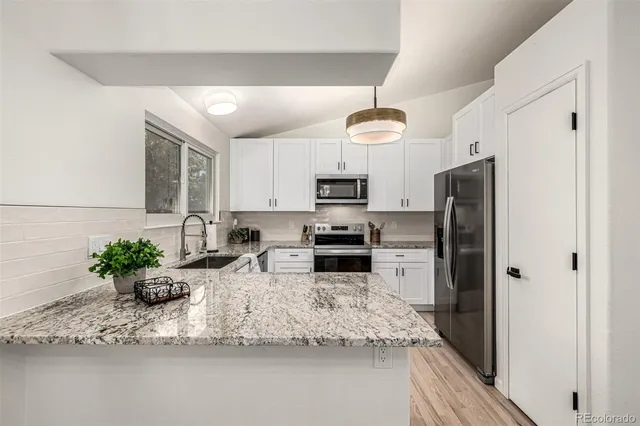 a view of a livingroom with a ceiling fan and a window