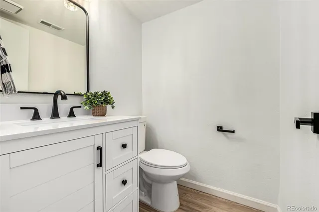 an empty room with fan and windows