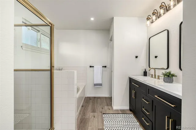 a bathroom with a bathtub and a shower