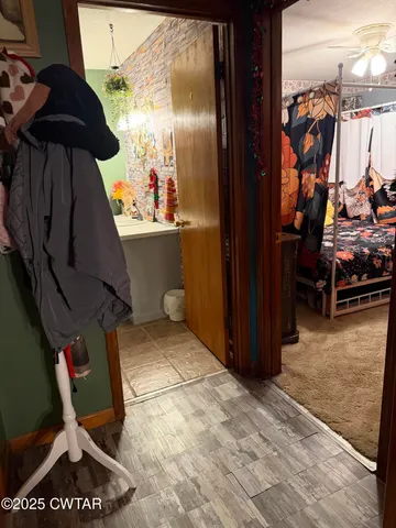 a bed room with a bed and a tv