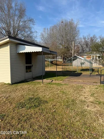 a view of a swimming pool with a patio