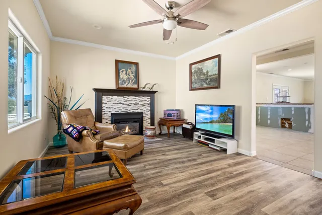 a work room with furniture and wooden floor