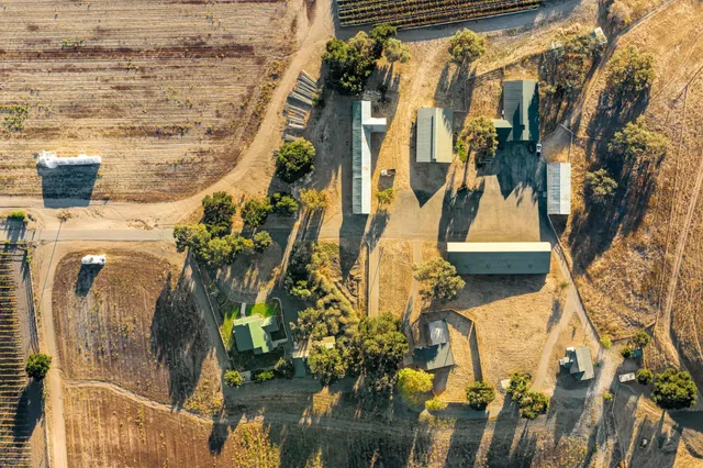 an aerial view of a house with a ocean view