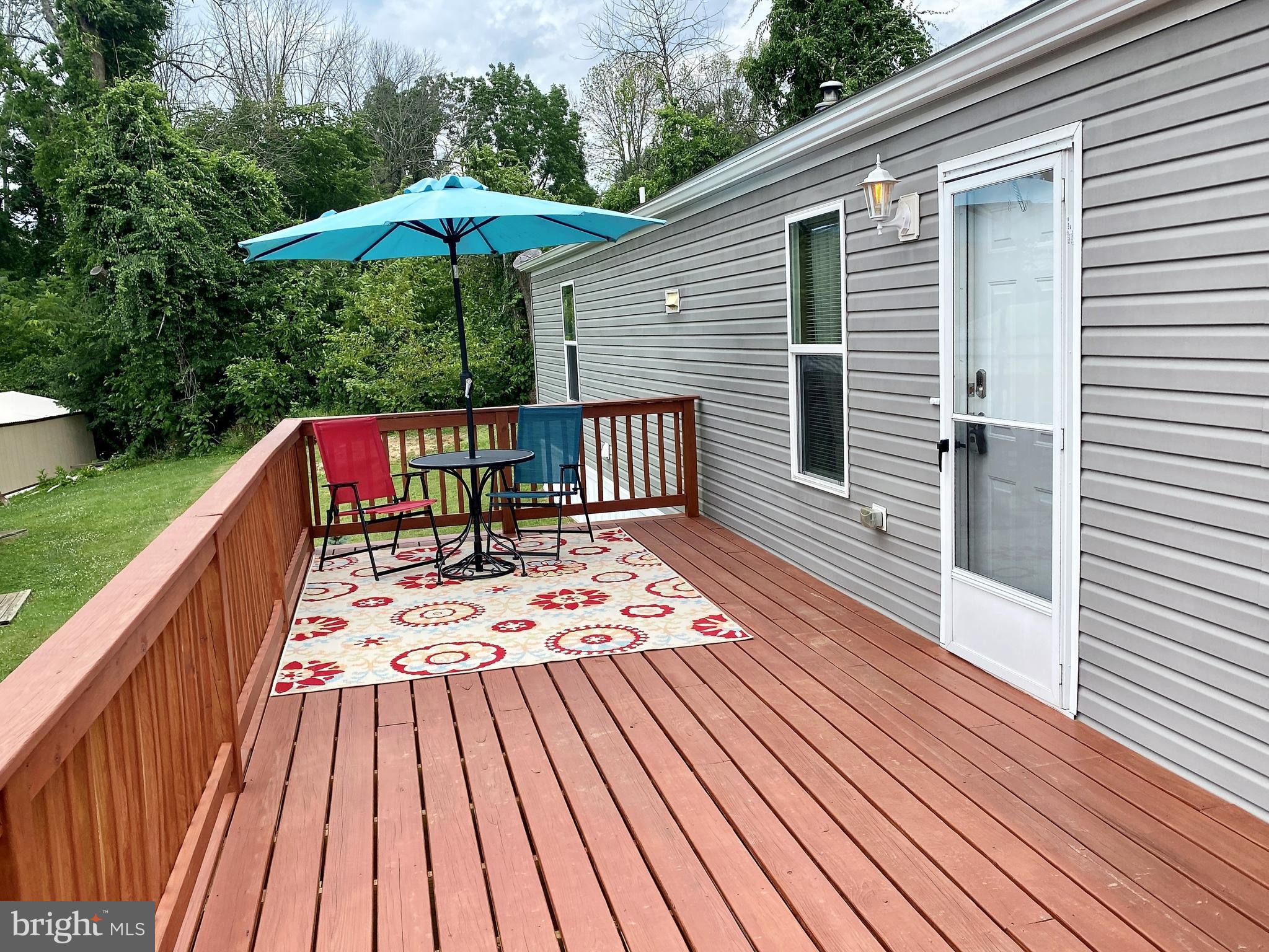 a view of outdoor space with deck and yard