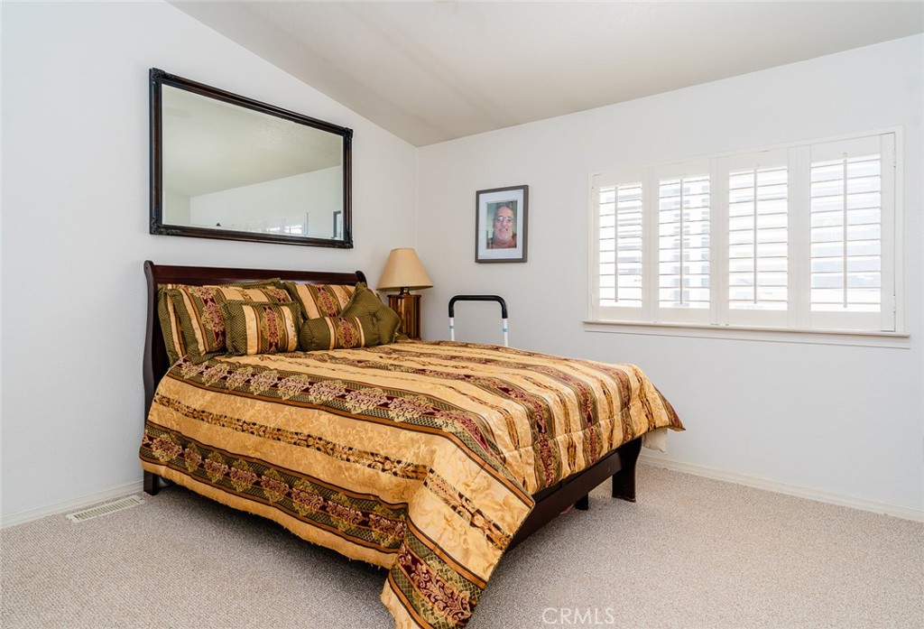 15621 Beach Boulevard Westminster, CA 92683 - Photo 12 of 25 a bed sitting in a bedroom next to a window