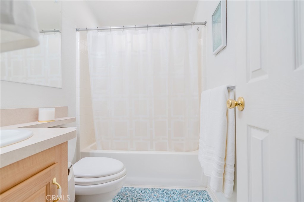 15621 Beach Boulevard Westminster, CA 92683 - Photo 15 of 25 a bathroom with a sink a toilet and shower