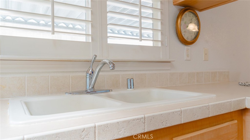15621 Beach Boulevard Westminster, CA 92683 - Photo 17 of 25 a bathroom with a bathtub and a window