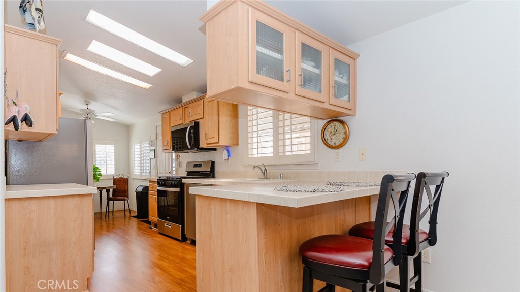 15621 Beach Boulevard Westminster, CA 92683 - Photo 23 of 25 a view of kitchen with cabinets and wooden floor