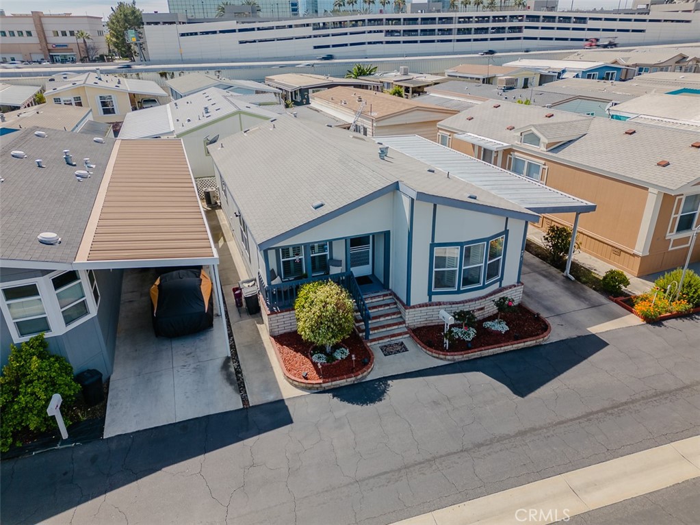 15621 Beach Boulevard Westminster, CA 92683 - Photo 5 of 25 a roof deck with a couch and potted plants
