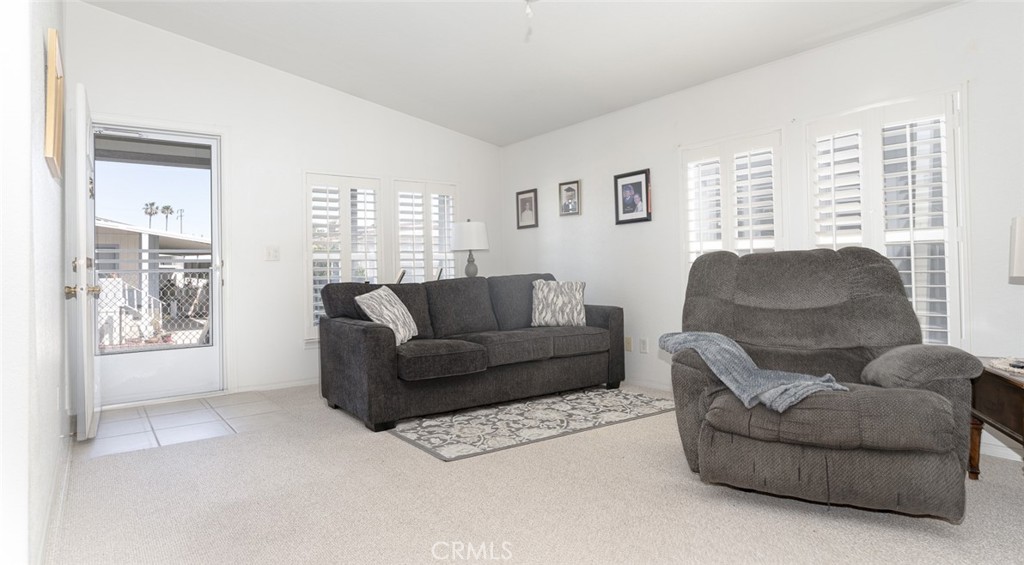 15621 Beach Boulevard Westminster, CA 92683 - Photo 10 of 25 a living room with furniture and a large window