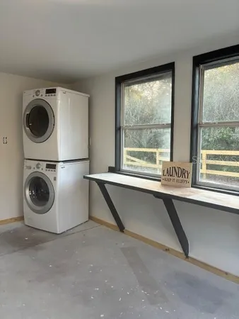 a kitchen with stainless steel appliances wooden floor and cabinets