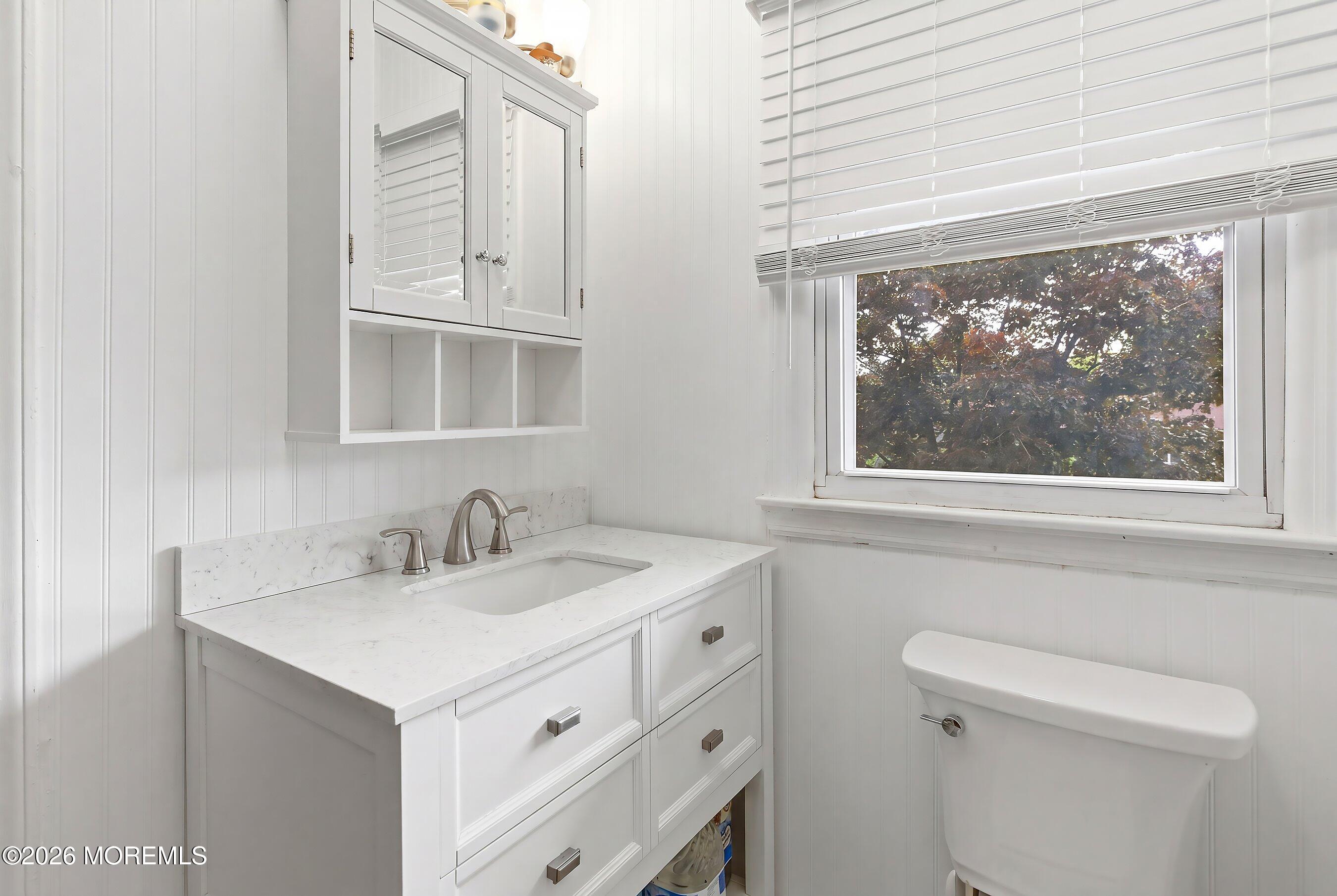 822 York Road Brick, NJ 08724 - Photo 18 of 37 a bathroom with a sink a toilet and a window