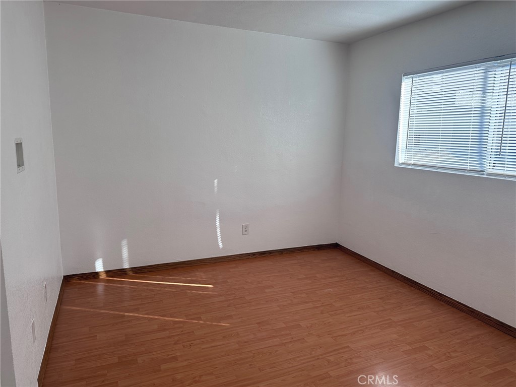 318 East Walnut Street, Unit B Santa Ana, CA 92701 - Photo 5 of 9 an empty room with a window